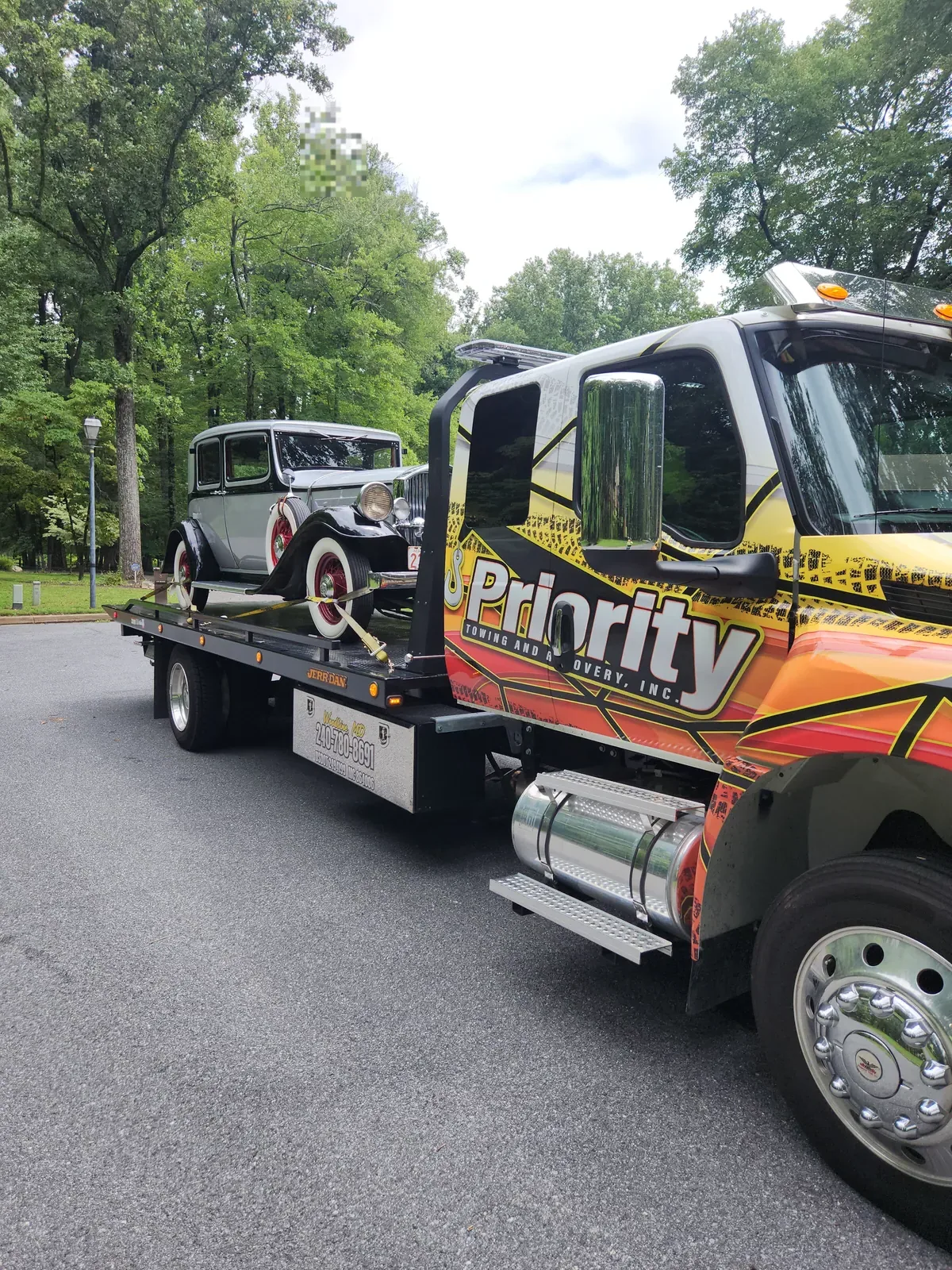 Vintage car on a Priority Towing rollback
