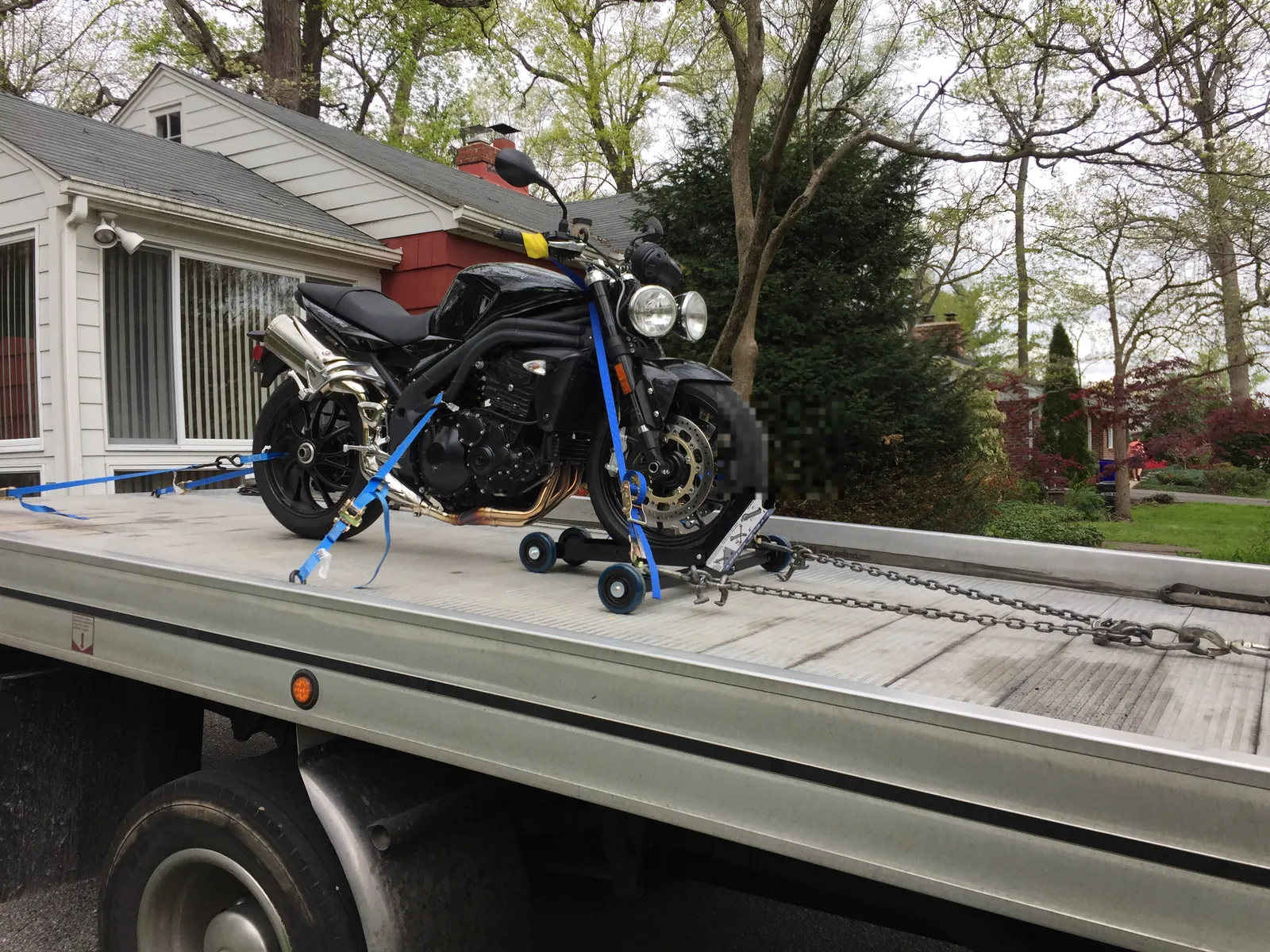 Motorcycle on a Priority Towing rollback