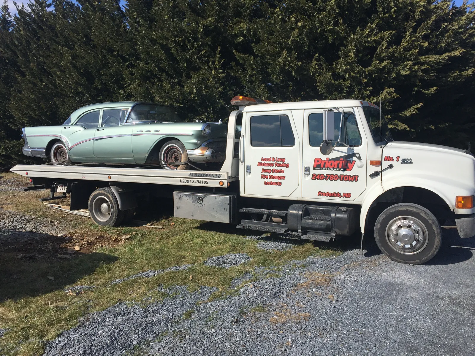 Classic Buick on a Priority Towing rollback